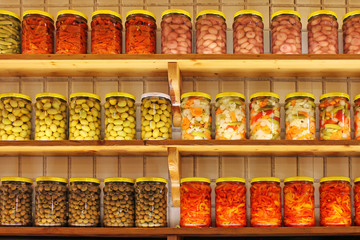 Shelves of Home Canning Vegetables. Food ingredients set in a row. 