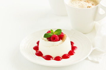 Delicious Italian dessert panna cotta with berries and berry sauce. Valentine's Day.