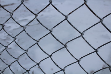 chain link fence with barbed wire