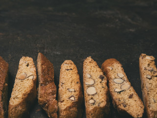 Biscotti - Traditional Italian Almond Dessert On Dark Copper Background. Cookies Arranged On The...