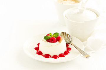 Delicious Italian dessert panna cotta with berries and berry sauce. Valentine's Day.