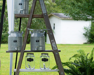 Ladder With Glass & Metal Jars Outside