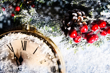 New Year clock dusted with snow and almost 12:00