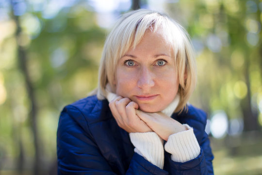 Forty Year Old Woman In The Park On The Street. Portrait Of Middle Age Man