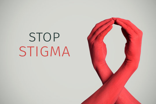 red awareness ribbon and text stop stigma