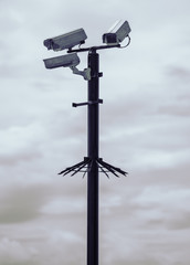 Rustic urban city surveillance cctv video monitoring cameras, spying on civilians. big brother is watching you.