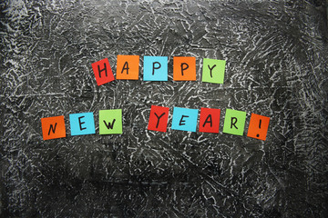 text "happy new year" on a dark background