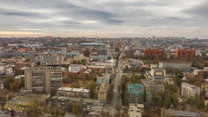 Fototapeta na wymiar Urban aerial view photo from drone of downtown skyline. Cityscape of Dnipro city in Ukraine on the background of the sky.