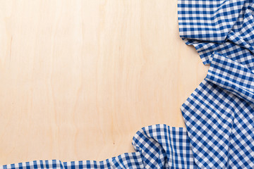 checkered tablecloth on wooden table