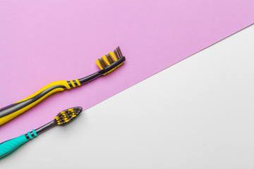 Toothbrushes on pink background
