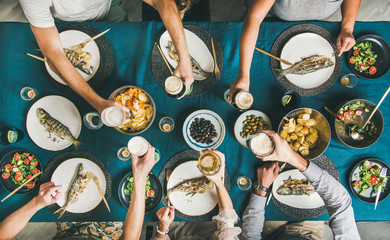 Fish and chips beer party gathering, friends eating, drinking and celebrating together. Flat-lay of...