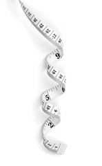 Curly measure tape, dieting or weight loss theme, isolated on white background. Black and white measure tape, top view.