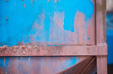 A hard pink and blue industrial machinery metal texture background, showing signs of scratches, usage. Beautiful industrial arty textured background perfect for type or logo