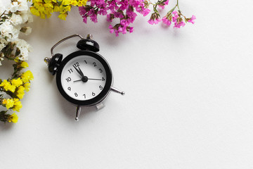 Spring Time Change Background with alarm clock and flower branches