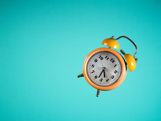 alarm clock on blue background