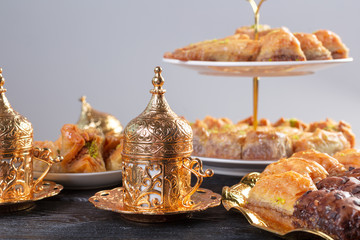 baklava with pistachio. turkish traditional delight on a dark wood background