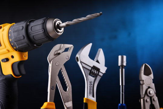 hardware tools including cordless drill and monkey spanner Stock Photo |  Adobe Stock