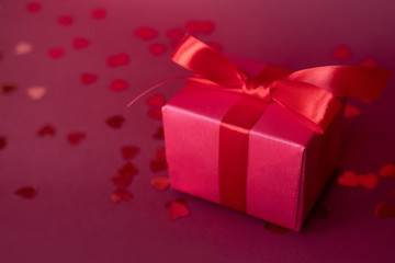 Presets with confetti on red background. Concept for Valentine's Day.
