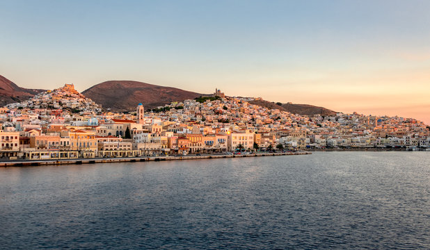 Fototapeta Panorama view of Ermoupoli with port, churches and the chora Ano Syros at first light, Syros, Cyclades, Greece