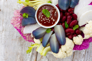 Delicious and healthy salad with colorful vegetables. Rainbow food.
