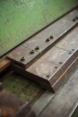A hard green and rusty industrial machinery metal texture background, showing signs of scratches, usage. Beautiful industrial arty textured background perfect for type or logo