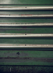 A hard green and rusty industrial machinery metal texture background, showing signs of scratches, usage. Beautiful industrial arty textured background perfect for type or logo