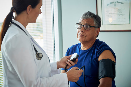 Doctor taking a patient's blood pressure