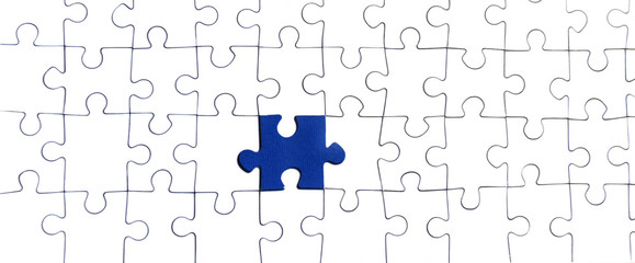 Background of white puzzle with bright blue puzzle center