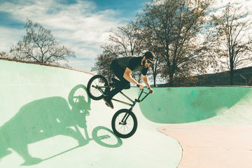 BMX rider making tricks .Guy riding a bmx bike