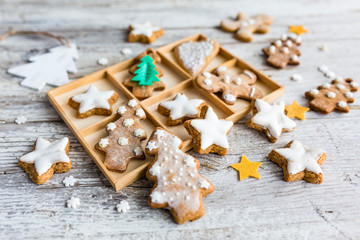 Homemade Christmas gingerbreads on a wooden background.
