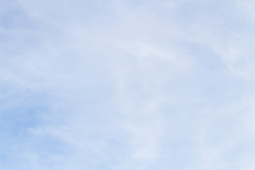Blue sky with white porous clouds in summer