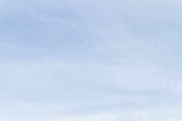 Blue sky with white porous clouds in summer