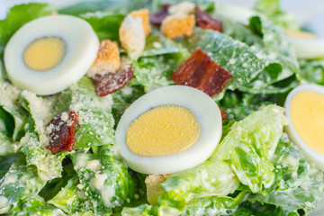 Fresh salad with sliced boiled egg clean and healthy food.