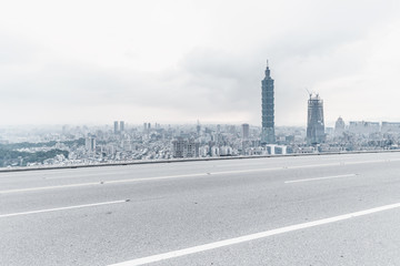 Panoramic skyline and modern buildings with empty road in Taiwan