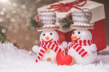 Snowman couple with and Christmas decorations