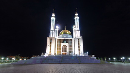 Fototapeta na wymiar Mosque Nur Gasyr in the city of Aktobe night timelapse hyperlapse. Kazakhstan