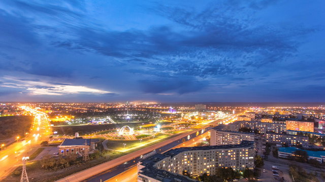Park named after the First President of the Republic of Kazakhstan in the city of Aktobe day to night timelapse. Western Kazakhstan.