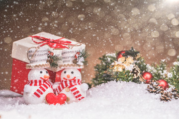 Snowman couple with red heart and Christmas decorations