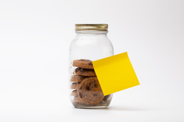 Chocolate chip cookies in a glass bottle