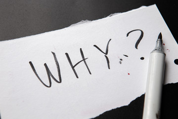 handwritten text Why as Question. written on white paper with black marker. Concept meaning Asking...