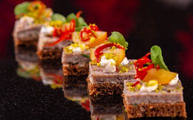 Fat on black bread with vegetables and oil