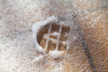 Imprint shoes on loose snow