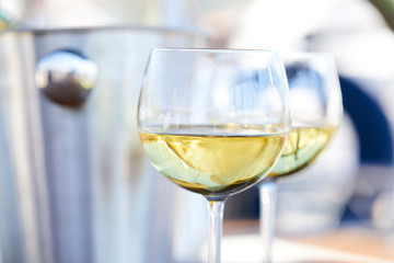 Pair of wineglasses against the yacht