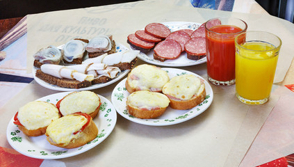 Sandwiches with sausage and cheese on a plate