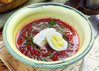 Red egg soup in a plate