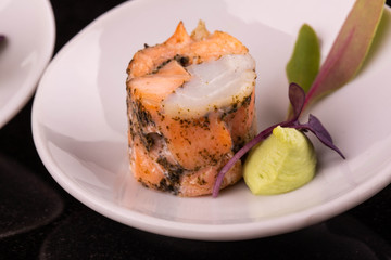 Roll from fish white and fishes red with souffle and greens