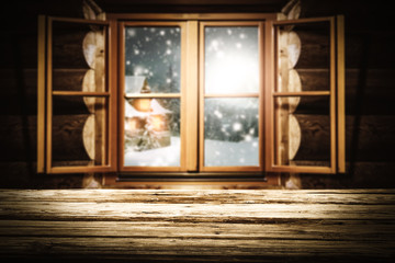 Fototapeta premium wooden table of free space for your decoration and wooden window with winter landscape 