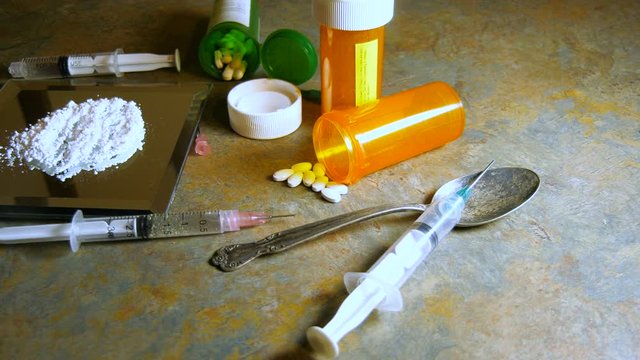 Judge's wooden gavel hitting with drug paraphernalia