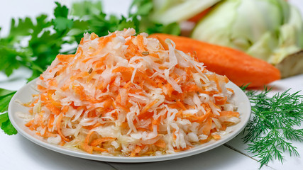 Salted cabbage in a plate on the table