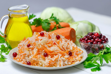 Salted cabbage in a plate on the table